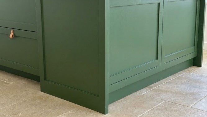 Green painted kitchen island end panel and toe kick