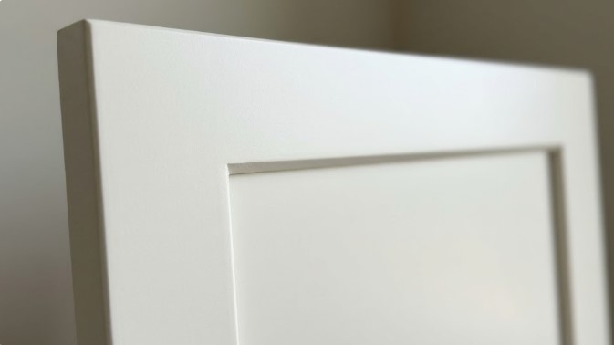 Close-up of a white painted shaker cabinet door